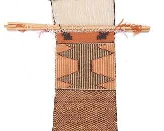 1219 A Diné (Navajo) two-faced twill loomer Second half 20th century Featuring a double weave in-progress sampler with various twill patterns, woven in brown, orange, and cream wool yarn with wool warps, cotton binding, and with various wooden loom bars and sticks 2 ft. 2 in. x 2 ft. approximately Estimate: $400 - $600