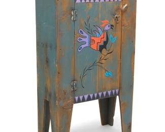 1347 A New Mexican-style painted wood cabinet Late 20th/early 21st century The hinged door with Zia Pueblo-style bird, opening to reveal a single shelf Height 48 3/4 in., width 28 1/2 in., depth 13 1/4 in. Estimate: $400 - $600