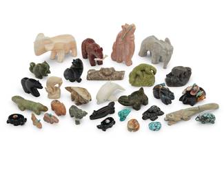 1426 A large group of Zuni carved animal fetish figures Second half 20th century, mostly Zuni Pueblo From artists including Michael Sanchez, Tom Nays, Sara Leekya, Wilfred Cheama, Lance Cheama, Julius Nello, M. Chavez, J Quam, and Russell Shack, including heartline bears and wolves, fishing bears, lynx, turtles, frogs, rabbit, lizards, a mole, a squirrel, a dolphin, and a ram, carved from jet, pipestone, serpentine, green serpentine, turquoise, onyx, and other hardstones, several with turquoise and shell inlay accents, and some mounted with offerings Most marked to base or to tag 33 pieces approximately Largest height 3 3/8 in., width 5 in., depth 2 1/4 in.; smallest height 3/8 in., width 1 in., depth 7/8 in. Estimate: $200 - $400