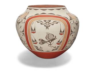 1064 Ruby Panana (b. 1954, Zia Pueblo) A large polychrome pottery olla Signed to underside: Ruby Panana / Zia The four-color jar with orange, taupe, and black bird and kiva decorations on white slip ground Height 14 in., diameter 16 3/4 in. Estimate: $1,000 - $1,500