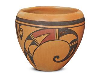 1031 A Hopi polychrome yellowware pottery jar Mid-20th century With red and black geometric motifs on cream slip ground Signed in slip to underside with undeciphered artist's flower and raincloud device Height 4 5/8 in., diameter 5 5/8 in. Estimate: $100 - $200