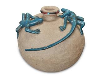 1081 Randall Blaze (b. 1949, Oglala Lakota [Sioux]) A stoneware lizard effigy vessel, 1987 The rim mounted with onyx, turquoise, and red stone, with haute relief blue glazed lizards to shoulder Incised with signature and date: R. BLAZE / 87 Height 8 3/4 in., width 10 1/8 in., depth 9 3/4 in. Estimate: $200 - $300