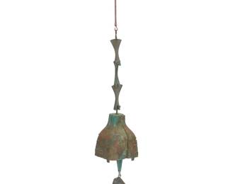 1311 Paolo Soleri (1919-2013) A Cosanti wind bell, mid/late 20th century; Paradise Valley, AZ With cast Paolo Soleri cipher The cast bronze bell with clapper and sheet copper fin Height overall 34 in.; height of bell 6 in.; height of fin 5 3/4 in. Estimate: $300 - $500