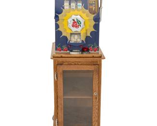 1305 A Mills 'Bursting Cherry' slot machine Circa 1937 The twenty-five-cent machine with three reels, housed in an enameled metal and wood case, raised on a glazed wood locking cabinet with single shelf and silver-toned metal paw feet Numbered to paper label applied to interior: No 396260 Height of machine 25 1/2 in., width 17 in., depth 15 1/2in.; height of cabinet 34 1/4 in., width 20 1/4 in., depth 20 in. Estimate: $600 - $900