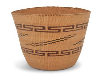 1153 A Tlingit polychrome basket 20th century; Pacific Northwest Coast A finely twined berry basket with 'false embroidery' designs worked in fretwork bands and diagonal stepped panels to the sides Height 5 in., diameter 6 3/4 in. approximately Estimate: $800 - $1,200