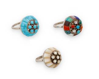 1359 Lee & Mary Weebothee (1927-2015 & 1934-1995, Zuni Pueblo) Three sterling silver domed rings, each cluster-set with cobblestone inlay, including one with turquoise, one with mother of pearl shell inlay, and one with multistone inlay including coral, turquoise, mother of pearl, shells, and lapis lazuli Each stamped: Lee/Mary [script] / Zuni 3 pieces Ring sizes 8 to 4 1/2 19.8 grams gross Estimate: $300 - $500