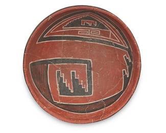 1028 A Four Mile polychrome pottery bowl Circa 14th/15th century With black and white stepped and geometric motifs on red slip ground Height 4 3/8 in., diameter 9 1/2 in. Estimate: $200 - $400