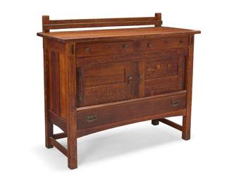 1192 A Limbert quarter-sawn oak sideboard, model 1331 Early 20th century With later dish rack above two locking drawers, two cabinet doors, and a long locking drawer Factory burn mark to upper drawer interior; stamped verso: 1331 Height 43 1/2 in., width 48 1/4 in., depth 21 in. Estimate: $800 - $1,200