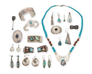 1410 A group of Southwest-style jewelry and accessories Mid/late 20th century Nineteen works comprising a Pueblo-style necklace with graduated disc beads and various stone beads including turquoise and shell, a chunky silver metal money clip with set turquoise-colored stones, two sterling silver cuff bracelets, including an eagle motif cuff with set turquoise inlay, as well as a concho-style bolo slide with set blue stone, two conchos, including a repoussé butterfly spacer with set turquoise, a mosaic inlay bear paw stick pin, a pair of multistone inlay watchstrap ends, four pairs of earrings, and six single earrings Most unmarked; seven variously marked for maker and for sterling: JGD / Navajo [leaf and flower pictographs] / Radiant Jewel Studio / K / JG/95 [etched] 24 pieces Necklace 24 in. L; cuffs 7 in. and 6 3/4 in. total inner C; earring pairs 2 in. to 1 in.; clip 1 x 2 1/4 in.; bolo 1 1/2 x 2 1/8 in. 247.1 grams gross Estimate: $300 - $500