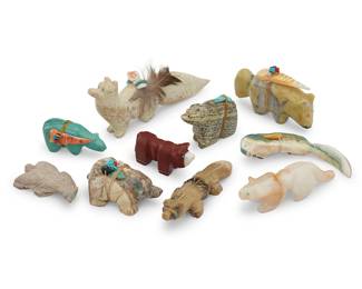 1423 Ten Zuni carved mammalian fetishes Mid/late 20th century, mostly Zuni Pueblo From artists including Edna Leki, Loubert Soseeah, and Mel S, comprising bears, a cougar, foxes, a cow, a mole, and various mustelids, most carved from various hardstones, as well as shell and pipestone, and six mounted with offerings Two signed, two with labels indicating artist 10 pieces Largest height 2 in., width 4 1/2 in., depth 5/8 in.; smallest height 1 in., width 2 in., depth 3/4 in. Estimate: $200 - $400