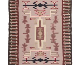 1297 A Diné (Navajo) storm pattern rug Late 20th century With a delicate central storm pattern motif flanked by stacked triangle columns and waterbug motifs, with a complex sawtooth border to two sides, woven in brown, red, black, cream, and pale lilac wool 2 ft. 8 in. x 2 ft. 3 in. approximately Estimate: $300 - $500