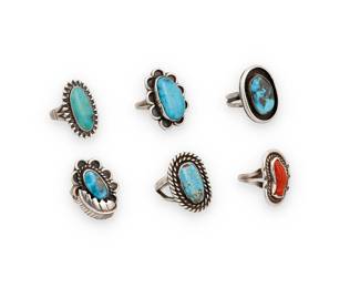 1417 Six Southwest silver and turquoise rings Mid/late 20th century A group of sterling silver and set turquoise or coral rings in various styles and shapes including one shadowbox set, and one with applied silver feather accent One etched: EJ [script] 6 pieces Ring sizes 8 3/4 to 5 1/4 43.5 grams gross Estimate: $200 - $400