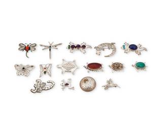 1403 A large group of Southwest-style figural sterling silver and set stone brooches Late 20th century A group of brooches featuring various animals and insects including turtles, lizards, butterflies, dragonflies, a scorpion, an eagle, a hummingbird, and a frog, in various styles, ten with set stones or stone inlay including malachite, lapis lazuli, amethyst, and turquoise, as well as three sterling silver pendant/brooches including a large turtle pendant, a button-style silver overlay eagle pendant, and a diminutive butterfly pendant with multistone inlay Ten variously marked for artist: VY/WWS / AM / A.P. / K / BT / M; thirteen marked for Sterling 15 pieces Largest 2 1/2 x 1 1/4 in.; smallest 1 1/4 x 1 in. 169.3 grams gross Estimate: $200 - $400