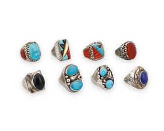 1384 Eight large Southwest silver and set stone rings Mid/late 20th century A group of chunky sterling silver rings, including three by Lee & Mary Weebothee (Zuni), one with elaborate sculptural coral and turquoise inlay and nugget silver accents, as well as a set coral and a set turquoise ring, together with a multistone inlay ring by Richard & Geneva Terrazas (Mexican & Zuni), two rings with double set turquoise and applied silver feather and wire accents, and two with set stone oval cabochons, one in lapis lazuli and one in onyx Four variously marked for artist: Lee/Mary Zuni / R. & G. T. / MC J; three marked Sterling 8 pieces Ring sizes 12 to 9 3/4 134.2 grams gross Estimate: $200 - $400