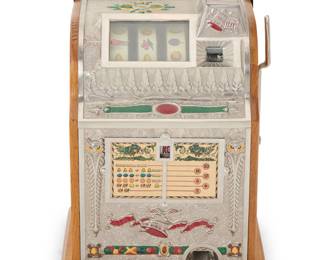 1303 A Mills 'Liberty Bell' slot machine Circa 1930s The five-cent machine with three reels, housed in a metal and wood case With manufacturer's applied label to right side proper; impressed in the wood: 119111 Height 25 in., width 16 1/2 in., depth 15 in. Estimate: $600 - $900