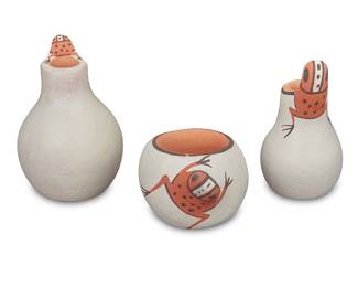 1045 Agnes Peynetsa (b. 1962, Zuni Pueblo) Three diminutive frog effigy vessels, 1994-1998 With red and black painted frog effigy and white slip ground Each signed, variously dated, and inscribed to underside: Agnes Peynetsa © / Zuni, N.M. 3 pieces Tallest height 1 3/4 in., diameter 1 1/8 in.; shortest height 7/8 in., width 1/ 1/2 in., depth 1 1/8 in. Estimate: $200 - $400
