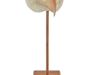 1132 Hib Sabin b. 1935 A bald eagle mask Carved and painted juniper Unsigned Height 4 3/4 in., width 6 3/8 in., depth 7 3/4 in.; stand height 17 in. including base Estimate: $700 - $900