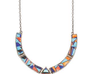 1400 Frank Yellowhorse (b. 1933, Diné [Navajo]) A sterling silver and multistone mosaic inlay collar link necklace with central teardrop pendant, featuring turquoise, spiny oyster, and lapis lazuli Stamped: Frank Yellowhorse [script, with horse]; further stamped: Navajo / Sterling 23 1/2 x 2 in. 80.6 grams gross Estimate: $300 - $500