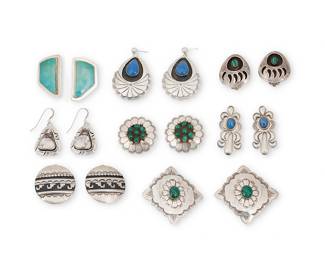 1415 Eight pairs of Southwest silver and set stone earrings Late 20th century Comprising eight pairs of earrings in various styles including concho stampwork and repoussé designs, shadowbox, and silver overlay, most with set stones including malachite, turquoise, and lapis lazuli, including a pair of oblong set turquoise earrings by Everett and Mary Teller (Diné [Navajo]), a pair of shadowbox set malachite bearpaw earrings by Les Peone, and a pair of white turquoise drop earrings with stamped edging (likely Elken Senter, Chickasaw) 16 pieces Variously stamped for artist: EMT [within a fish] / BB / ES / NW / L. Peone; four stamped for Sterling Largest 2 in.; smallest 1 1/4 in. 106.8 grams gross Estimate: $200 - $400