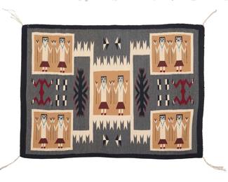 1294 A Diné (Navajo) storm pattern pictorial Yei rug Second half 20th century Woven in grey, black, red, cream, and blue in a storm pattern variation featuring five panels each with two standing Yei figures and multiple floating elements including water bugs 4 ft. 1/2 in. x 2 ft. 11 in. approximately Estimate: $500 - $700