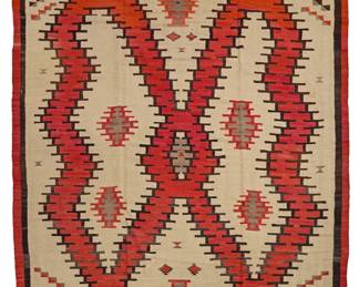 1223 A large Diné (Navajo) rug Mid-20th century Woven in cream, red, brown, and grey wool, with a central medallion taking the form of an abstract butterfly, with additional diamonds and stepped devices, framed in a double banded border. 11 ft. 11 in. x 9 ft. approximately Estimate: $3,000 - $5,000