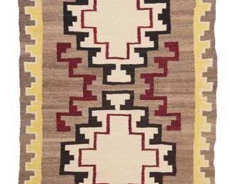 1269 A Diné (Navajo) regional rug Mid-20th century Woven in white, brown, yellow, red, and mottled brown wool featuring two stacked stepped diamonds with floating stepped motifs and with a stepped border to two sides 5 ft. 6 in. x 3 ft. 4 in. approximately Estimate: $500 - $700