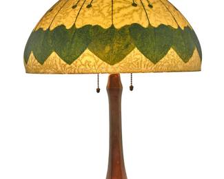 1367 A Handel painted glass table lamp Early 20th century The shade with textured exterior depicting ivy, mounted on a patinated metal base issuing two lights, electrified Shade signed: Handel #5468; heat cap ring impressed: HANDEL Lamps / PAT'D NO. / 979664; base impressed: HANDEL Height overall 21 in.; height of shade 8 in., diameter 15 1/2 in. Estimate: $2,000 - $3,000