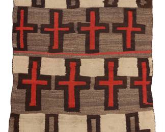 1228 A Diné (Navajo) regional rug First half 20th century Featuring four bands of crosses woven in red, brown, cream and mottled brown wool, with banded ends 5 ft. 6 in. x 3 ft. 6 in. approximately Estimate: $800 - $1,200