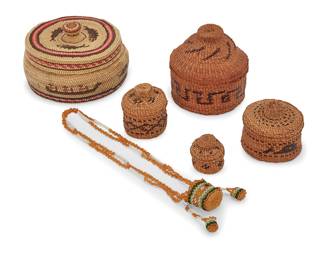 1157 A group of Northwest Coast basketry items Second half 20th century Seven works: Lillian Buchert (b. 1904 - d., Tsimshian) Four polychrome twined yellow Alaskan cedar lidded baskets in various sizes and with imbricated designs including geometric banding, and pictorial designs such as a whale and fish 4 pieces Largest height 3 1/4 in., diameter 3 1/2 in.; smallest height 1 1/4 in., diameter 1/4 in. Carolyn Mickey (20th century, Hesquiaht/Nuu-chah-nulth; Vancouver Island, B.C.) A polychrome twined lidded pictorial basket featuring whales, fish, and canoe motifs, and with striped banding to lid and near base Height 2 3/4 in., diameter 4 3/4 in. Mary Long Feather (20th century, Yakama, South-central Washington) A polychrome beaded necklace in yellow, green, and white, with a basket-form pendant with a hide base and dentalium shell spacers, with a pair of matching earrings 3 pieces Necklace 34 x 1 in.; earrings each 2 in. 8 pieces total Estimate: $100 - $200