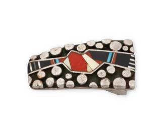 1356 Danny Romero (1954-2018, Yaqui/Spanish) A tapered sterling silver belt buckle with scattered raised silver dots mosaic stone inlay including turquoise, coral, and mother of pearl Stamped: D R.MER. / Sterling / [starburst pictograph] 1 x 1 3/4 in. 30.1 grams gross Estimate: $700 - $1,000
