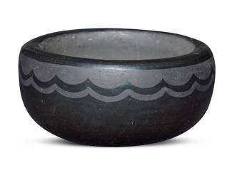1070 Crucita Calabaza (Blue Corn) (1921-1999, San Ildefonso Pueblo) A small blackware pottery bowl With black-on-black painted band of cloud motifs below the rim Incised with signature to underside: Blue Corn / San Ildefonso / Pueblo Height 1 5/8 in., diameter 3 3/8 in. Estimate: $300 - $500