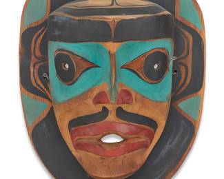 1145 A Northwest Coast polychrome carved cedar mask Third quarter 20th century Marked in ink verso: NW / 64 Height 13 3/4 in., width 10 3/4 in., depth 5 1/2 in. Estimate: $200 - $400