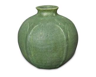 1097 A Grueby Faience Company glazed earthenware vase Early 20th century Molded with foliate designed in relief Impressed to underside: GREUBY POTTERY / BOSTON USA Height 3 7/8 in., diameter 4 in. Estimate: $1,500 - $2,500