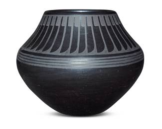 1067 Maria Martinez & Popovi Da (1887-1980 & 1923-1971, San Ildefonso Pueblo) A blackware pottery jar With black on black band of feather motifs to shoulder Incised to underside: Maria / Popovi / 365 Height 6 1/4 in., diameter 8 in. Estimate: $800 - $1,200
