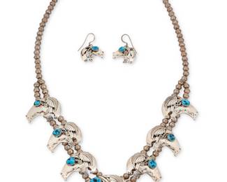 1399 A Southwest sterling silver and turquoise heartline bear necklace demi-parure set Late 20th century A chunky squash blossom-style necklace with six heartline bear 'blossom' plaques and a larger central bear, each with set turquoise and silver feather and floral overlay accents and mounted on a double strand of silver beads, with a pair of matching earrings 3 pieces Each stamped: RS [larger S] / Sterling, likely for Roger Skeet, Jr. (b. 1933, Diné [Navajo]) Necklace 24 1/2 x 2 1/2 in.; earrings 1 3/8 in. 91.2 grams gross Estimate: $300 - $500