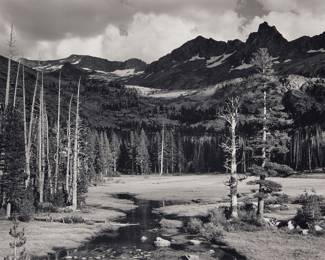 1205 After Ansel Adams (1902-1984) "Peaks and Meadow, Lyell Fork of the Merced River, Yosemite National Park," one plate from "Yosemite Special Edition Photographs," 1943 Gelatin silver print on paper mounted to board, as issued From the edition of unknown size, printed later by Alan Ross from Adams' original negative under his supervision Unsigned, as issued; with the "Special Edition Photographs of Yosemite by Ansel Adams" black ink stamp including the title, printer's credit, and printer's initials in ink, all on the verso of the mount Sight: 7 1/8 x 9 1/4 in. Estimate: $600 - $800