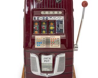 1302 A Mills 'High Top 7-7-7' slot machine 1940s The five-cent machine with three reels, housed in an enameled metal and wood case With manufacturer's applied label to right side proper Height 26 1/4 in., width 19 in., depth 15 1/4 in. Estimate: $800 - $1,200