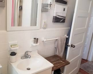 Petite vanity; storage tower; mirrored medicine cabinet