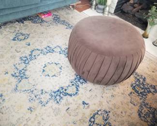 Area rug; pouf