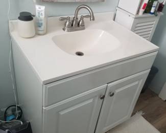 Bath vanity; Brush Your Teeth sign