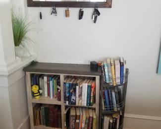 Bookcase & books; wall mirror with hooks
