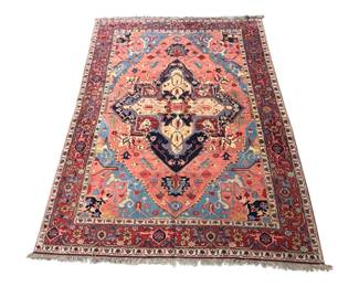 Rust and blue traditional rug with bold central medallion and decorative border.