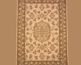 Gold and ivory traditional rug with an elaborate medallion and detailed floral pattern.