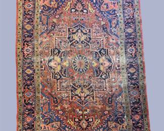 Soft multicolor traditional rug with distressed detailing and warm vintage-inspired tones.