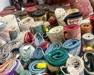 Colorful assortment of smaller rugs and runners.