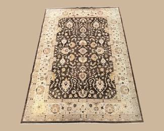 Ivory rug with dark floral field and classic decorative border.