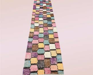 Colorful runner with a playful multicolor block pattern.