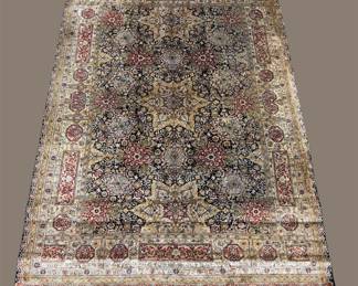 Muted traditional rug with soft vintage-inspired colors.