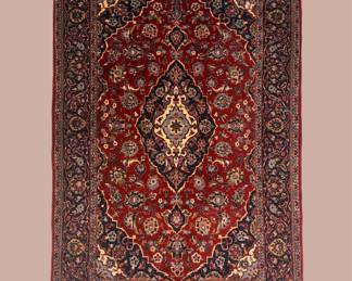 Rich red traditional rug with an ornate central medallion.