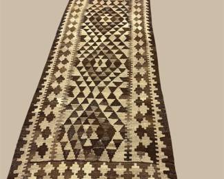 Black and ivory runner with a striking geometric diamond pattern.